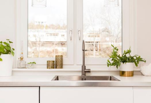 kitchen sink in front of sunny window